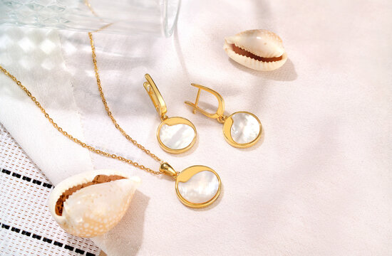 Elegant jewelry set. Jewellery set with gemstones. Product still life concept. Ring, necklace and earrings.