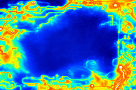 Blue, green, yellow and orange false colors flow around a dark central area like a thermal map. Temperature visualization and scientific data background