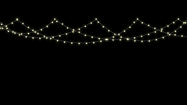 String of decorative string lights hanging against black background for festive or event decoration