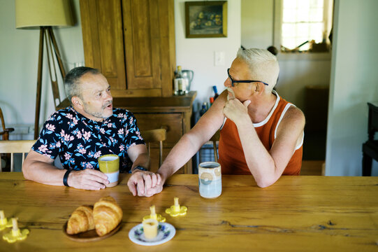 happy retired lgbtq couple in love at home