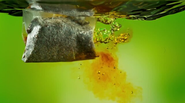 Super Slow Motion of Falling and Extracting Tea Bag in Hot Water at 1000fps.