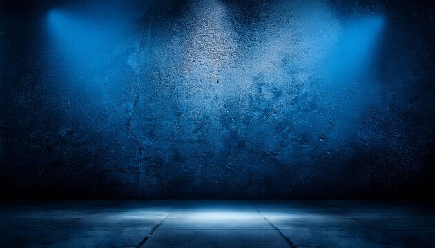 photo of dark moody concrete studio backdrop with dramatic blue lighting creating an atmospheric and textured background