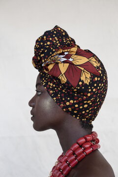 A Model posing in stylish head rap and beads