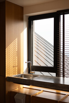 Modern Sink With Concrete Countertop And Wood Paneling