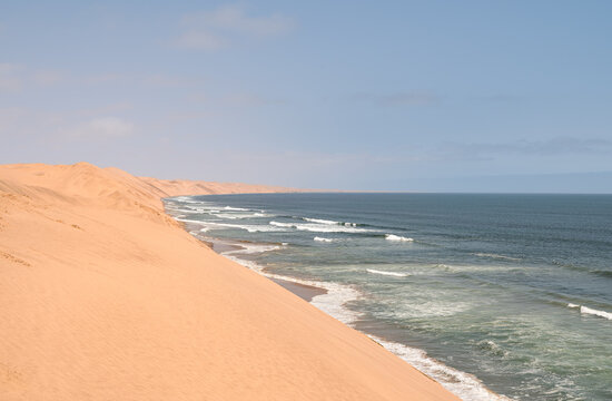 The coastline and sand dunes on the edge of the Namib desert just south of Walvis Bay, Namibia, Africa