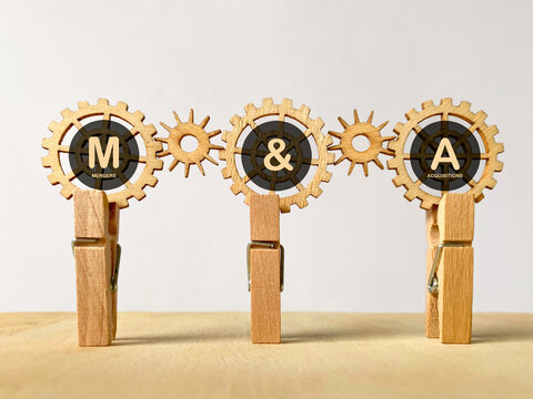 Wooden Gears Forming  M&A Merger and Acquisition Business Concept