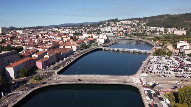 Aerial view of pontevedra cityscape with bridges and river