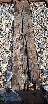 Weathered Wooden Railroad Tie With Gravel Ballast Texture