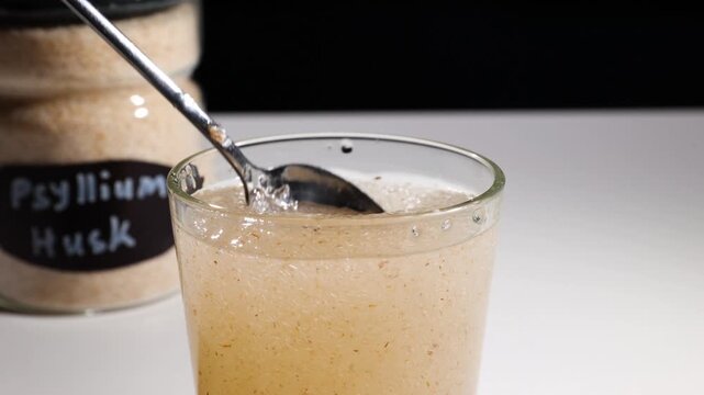 Textured psyllium husk gel formation in water showcased in a studio shot demonstration