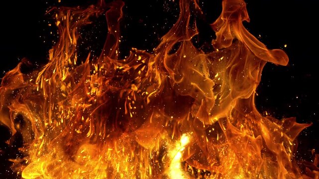 Super Slow Motion Shot of Real Big Fire Flames with Sparks Isolated on Black at 1000fps.