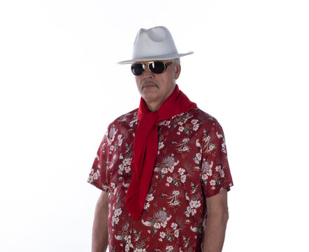 Portrait of an old cowboy in a Hawaiian shirt