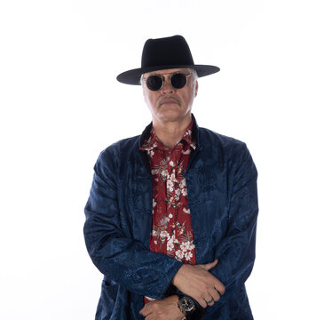 Portrait of an old cowboy in a Hawaiian shirt