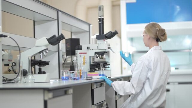 Scientist performing microscopic analysis in a modern laboratory setting for medical research study