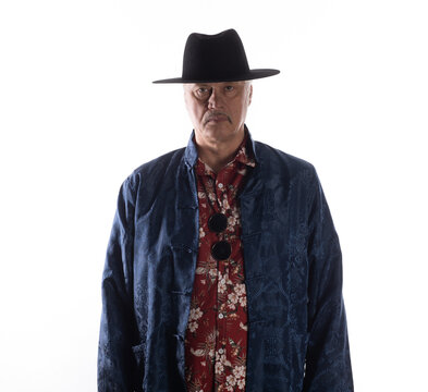 Portrait of an old cowboy in a Hawaiian shirt