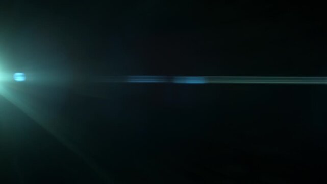 Linear Anamorphic Lens Flare on Black Background Shooted in Slow Motion.