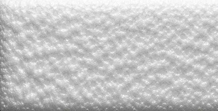 White polyurethane foam texture background. Close up view shows bumpy surface of expanded polystyrene material. Soft protective packing foam used for shipping fragile goods insulation in warehouse.