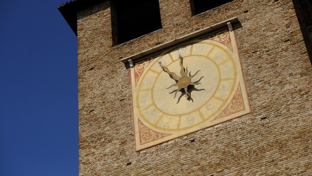 Close up of the ancient frescoed clock on the tower of Castelvecchio, Verona