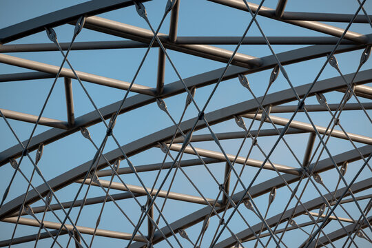 Krakow, Poland - July 18, 2026: Vertical view of the steel lattice structure of the J&oacute;zef Piłsudski Bridge.