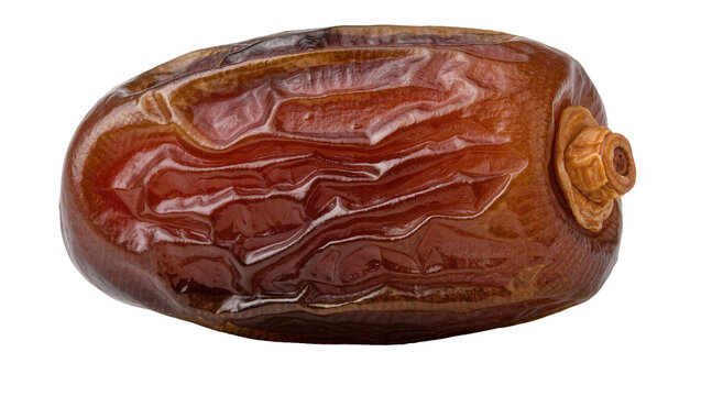 Single ripe Medjool date with wrinkled skin, isolated on transparent background