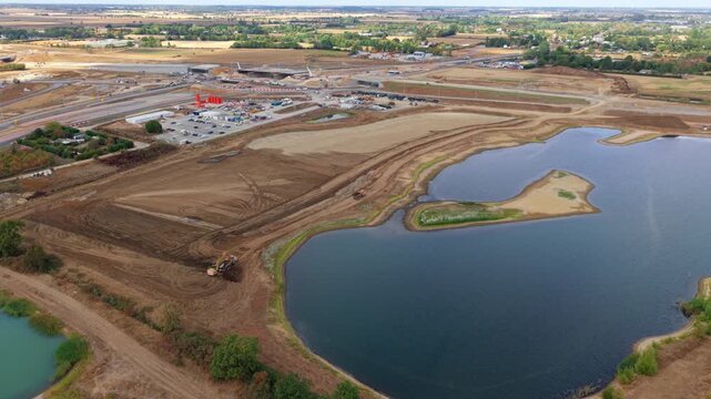 Aerial view of heavy plant machinery conducting extensive earthworks at a highway junction in Bedfordshire, UK