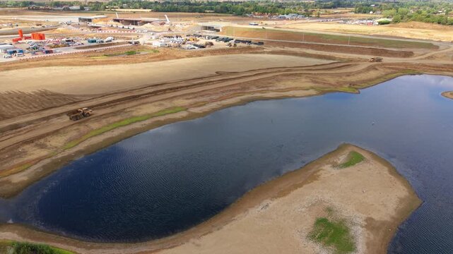 Aerial view of heavy plant machinery conducting extensive earthworks at a highway junction in Bedfordshire, UK