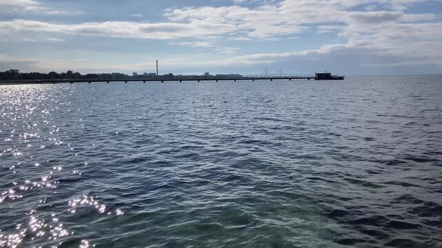 View from a bathing pier at Ribersborg beach with the Oresund bridge on the horizon
