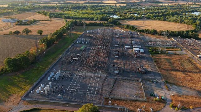 Aerial view of a major 400kV electrical transmission substation and transformer yard in Northamptonshire, UK