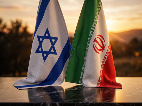 table flags of israel and iran are installed touching each other against a golden sunset indicating the path to international dialogue and a diplomatic agreement
