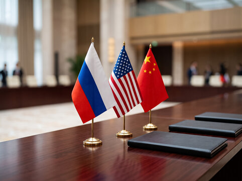 flags of russia usa and china standing on table in negotiation room in front of closed folders symbol of trilateral diplomacy geopolitics and international state relations