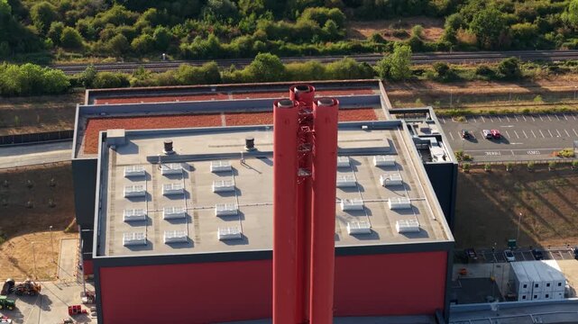 Close-up aerial view of industrial power station exhaust stacks and rooftop ventilation systems in Bedford, UK