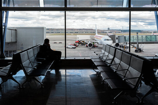 Traveler Silhouetted Awaiting Departure at Madrid Barajas T4