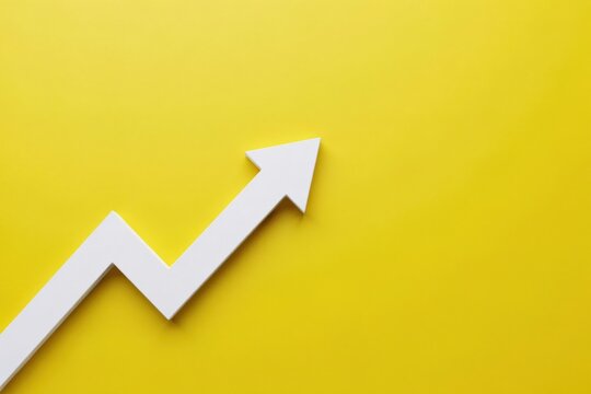 White arrow graph increasing on yellow background. Represents growth and success.