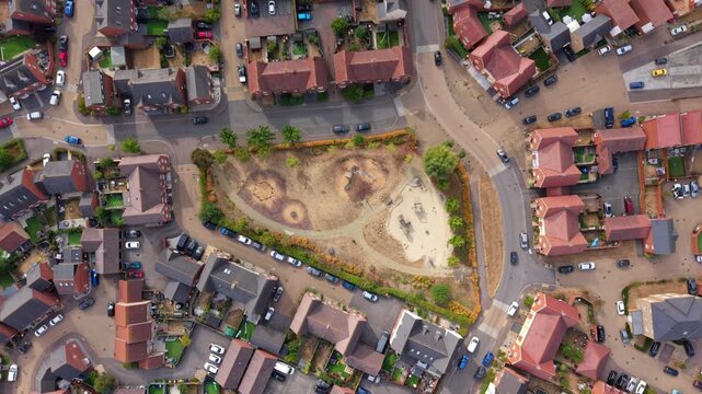 Aerial view of modern residential housing estate and suburban road network in Bedford, UK