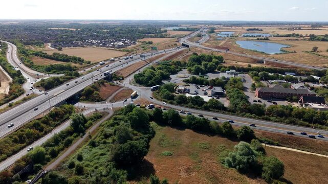 Aerial view of busy traffic flowing through a major motorway junction on the A1 road in the UK