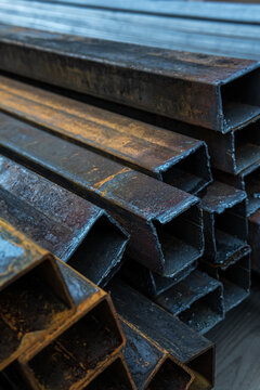Industrial rusty metal profile tubes stack