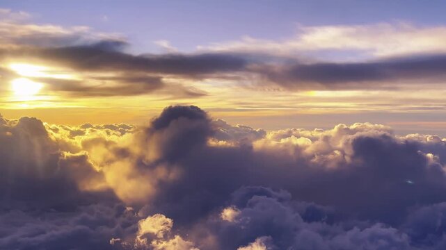 Golden sunrise breaking through dramatic clouds during cinematic aerial ascent with sunbeams
