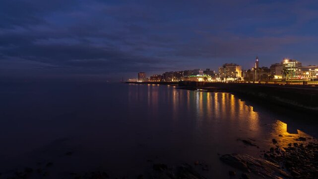 Night to day timelapse clip of Montevideo in Uruguay seen from the beach