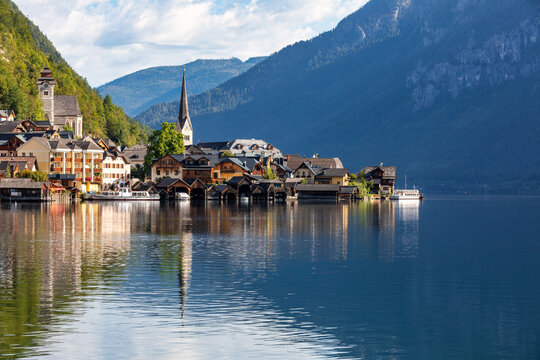 Picturesque Hallstatt Village Reflection on Calm Lake with Alpine Mountains in Austria