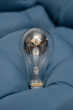 Pool ball through a light bulb