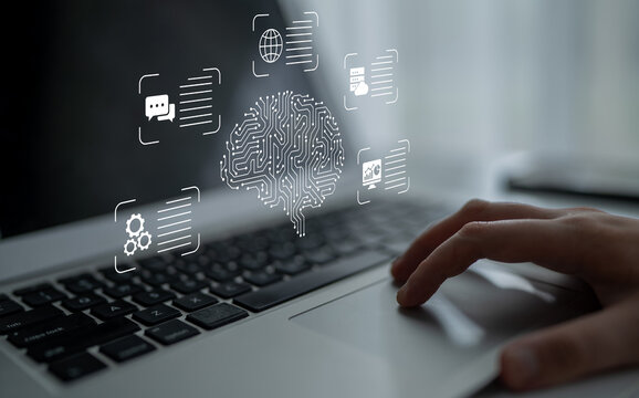 A close-up view of a hand using a laptop touchpad, showcasing a digital brain surrounded by technology icons that symbolize innovation and data processing in a contemporary workspace. Nascent