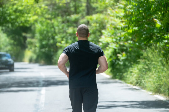 A man running along the road