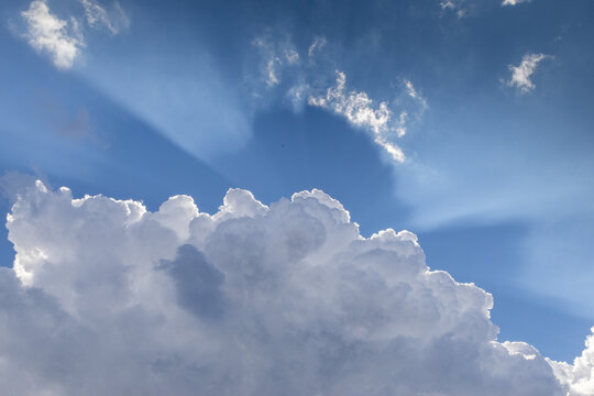 blue sky  white clouds and sunrays