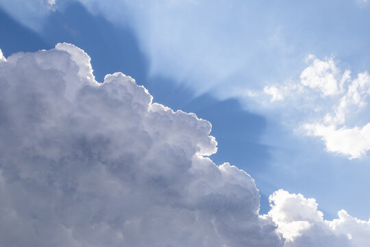 blue sky  white clouds and sunrays
