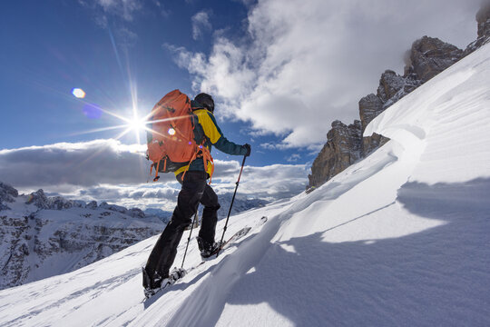 Winter Mountain Scenery with Man on Cross-Country Skis