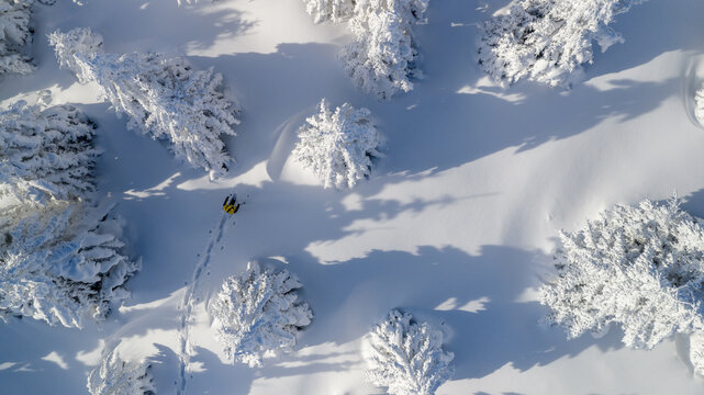Winter Mountain Scenery with Man on Cross-Country Skis
