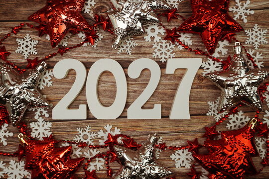 2027 Happy New Year and Christmas decoration on wooden background