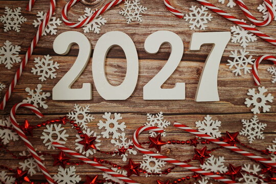 2027 Happy New Year and Christmas decoration on wooden background