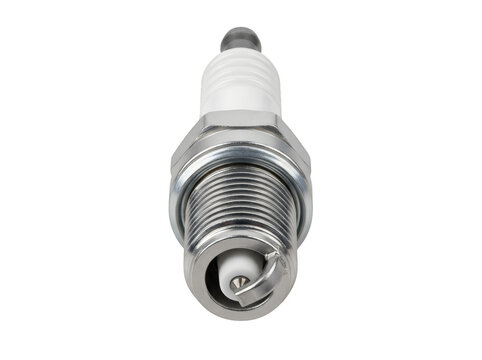 Close-up view of a spark plug with metallic threading and ceramic insulator.