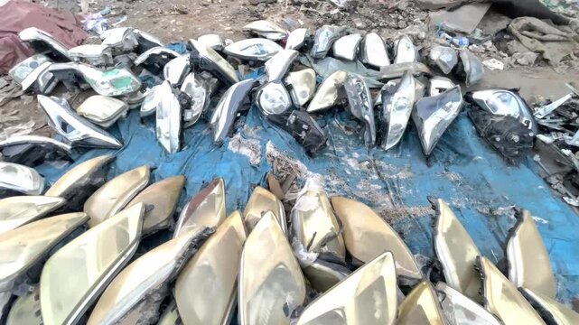 Large Collection of Used Car Spare Parts and Automotive Body Panels in a Scrap Market, vehicle dismantling and salvage market, showcasing recycled car parts and the automotive