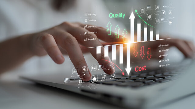 Businessman Analyzing Quality and Cost Metrics with Digital Overlay on Laptop Keyboard in Modern Office Setting. Bitwise.